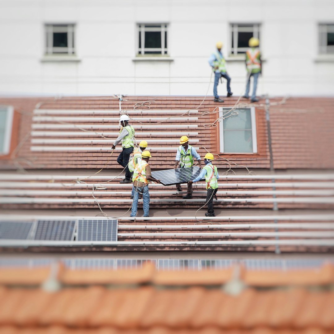 Technician inspecting solar panels